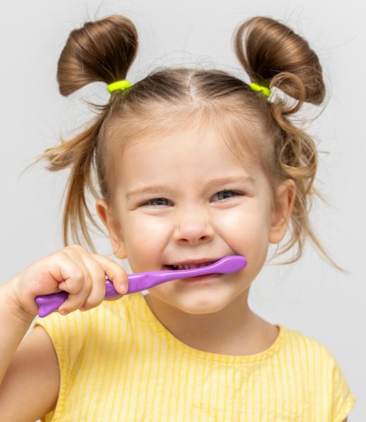 Child,In,A,Yellow,T-shirt,With,Clean,Teeth,Brushing,On